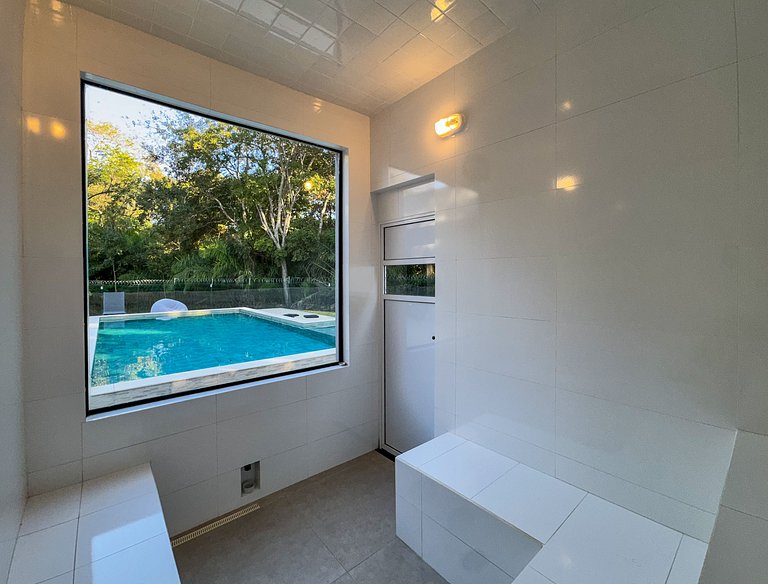 Casa sofisticada c/ 4 suítes, piscina e sauna