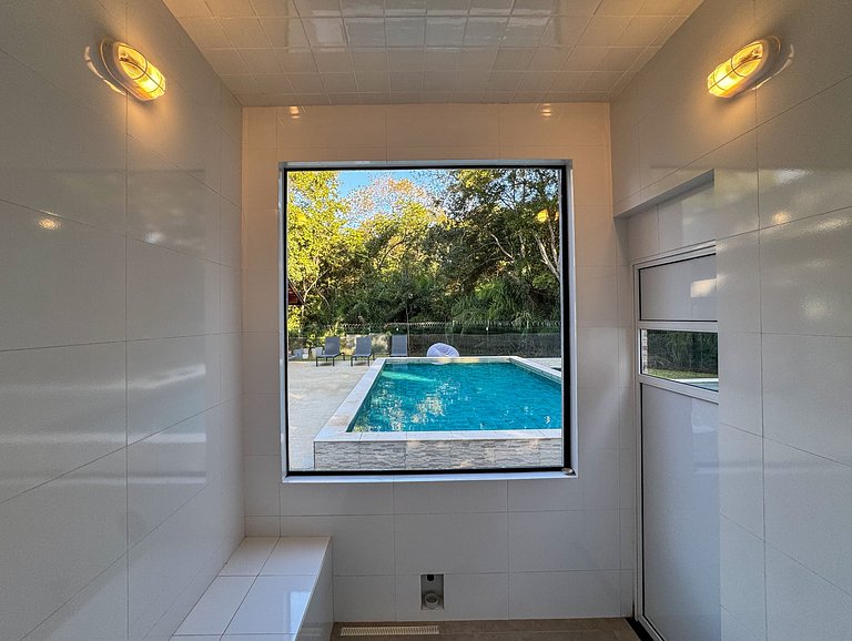 Casa sofisticada c/ 4 suítes, piscina e sauna